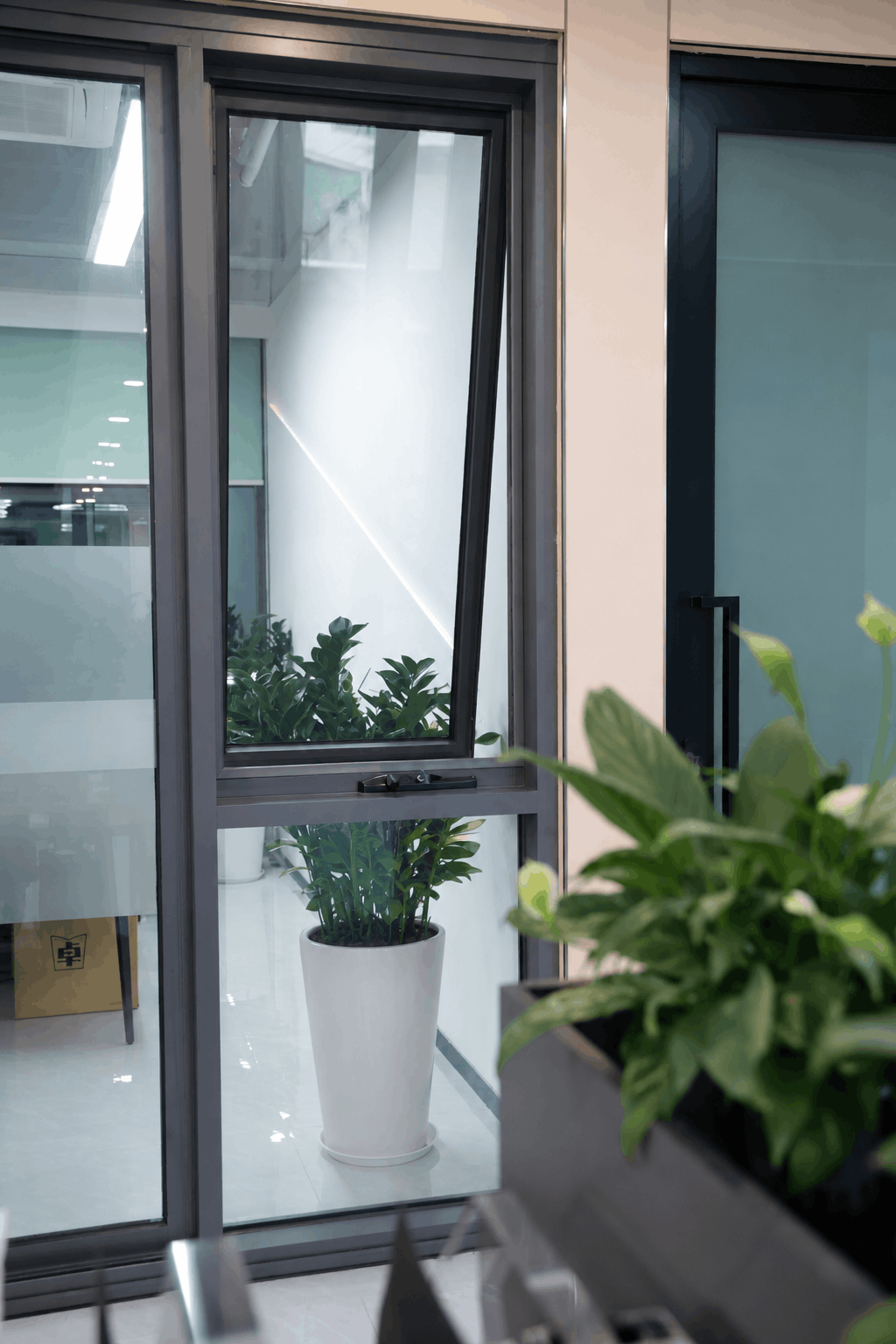 Modern black Aluminium awning window, partially open